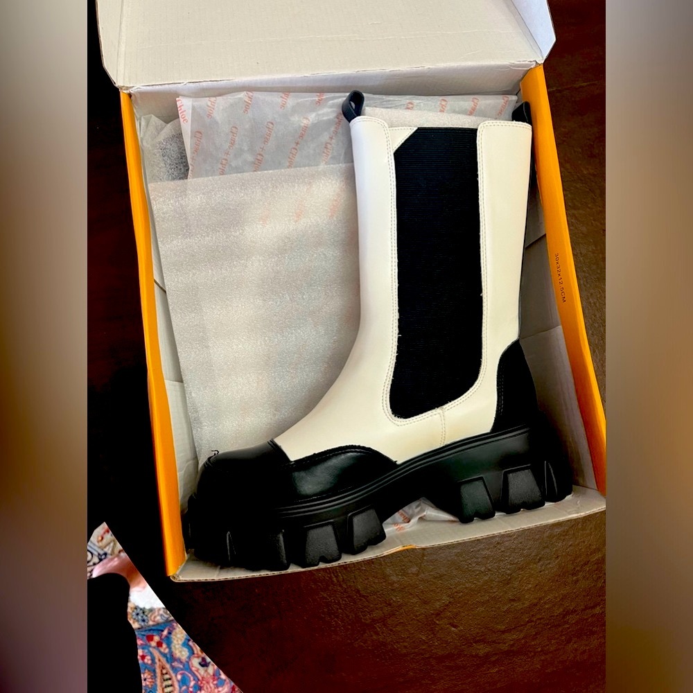 BRAND NEW IN THE BOX NEVER USED Chelsea boot lifted with a lugged platform heel.